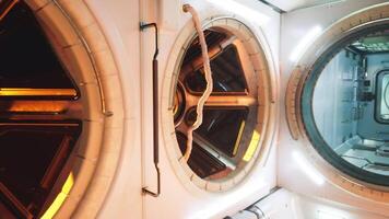 CGI Interior view of a space station module featuring circular windows and lights video