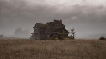 CGI Mysterious abandoned house surrounded by fog on a lonely landscape video