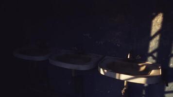 CGI Rustic wash area with textured walls and soft light in an abandoned setting video