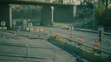CGI Construction work on a road under a bridge with warning signs and barriers video
