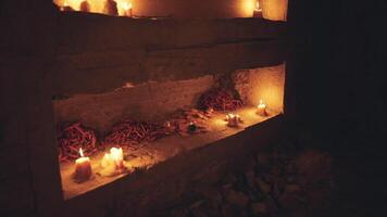 CGI Candles shining softly in a dimly lit spiritual space at night video