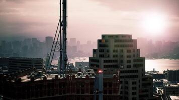 CGI City skyline at sunset with buildings and communication tower in view video