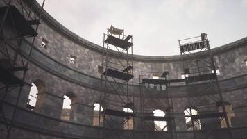CGI Restoration work taking place inside an ancient stone amphitheater video