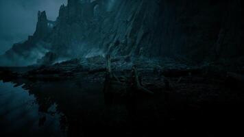CGI Mysterious landscape featuring rugged cliffs and reflective water at dusk video