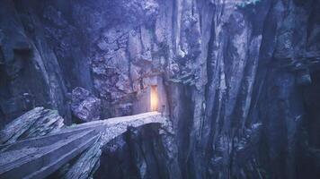 CGI Mysterious glowing entrance within rocky cliffs at twilight video