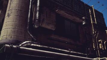 CGI Urban industrial structure with exposed pipes in a city setting at dusk video