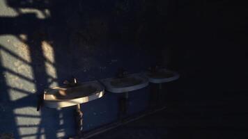 CGI Three sinks casting shadows in a dimly lit room with blue walls video