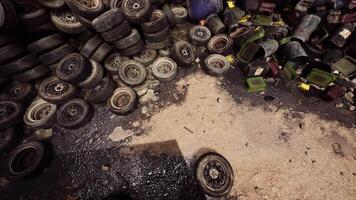 CGI Discarded tires and debris in a cluttered urban junkyard with clear sky video