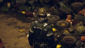 CGI Worker examines debris in a cluttered industrial site during nighttime hours video
