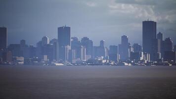 CGI Dramatic skyline view of a bustling city against a moody backdrop at dusk video