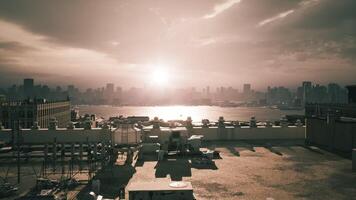 CGI Sunset over a bustling city skyline with rooftops in the foreground video