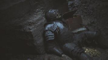 CGI Knight fell in battle rests in cave with treasures surrounding video