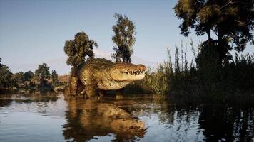 CGI Large crocodile basking by the waters edge in a lush landscape video