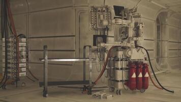 CGI Industrial machinery with red tanks in a futuristic interior space setting video