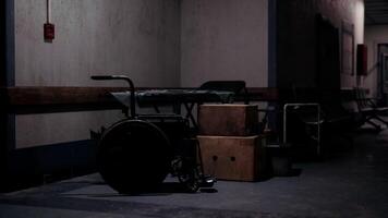 CGI A dimly lit hospital hallway featuring a wheelchair and cardboard boxes video