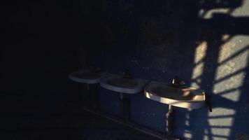 CGI Abandoned restroom with three sinks and dark shadows on the wall video