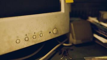 CGI Old computer monitor with buttons and dust in a cluttered workspace video