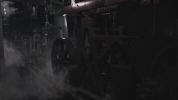 CGI Industrial machinery operates in low light with smoke in the background video