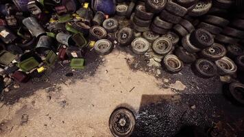 CGI Abandoned tires and waste containers at a junkyard on a cloudy day video