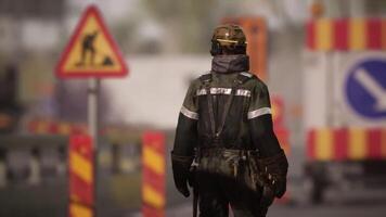CGI Worker in safety gear walking through construction site with warning signs video