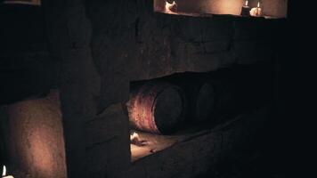 CGI Candles illuminate a rustic cellar with wooden barrels and stone walls video