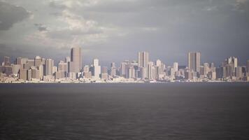 CGI A panoramic view of a city skyline under a cloudy sky at dusk video