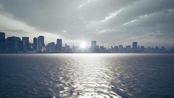 CGI Sunset over the city skyline reflecting on calm waters during twilight video