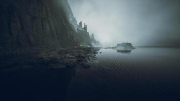 CGI Mysterious landscape with misty cliffs and calm waters at twilight video
