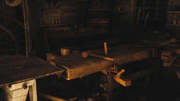 CGI Workshop interior showcasing rustic tools and equipment amidst shadows video