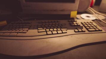 CGI Detailed view of a vintage computer keyboard on a cluttered desk at night video