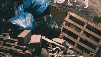 CGI Trash bags and discarded materials piled in a dimly lit alleyway video