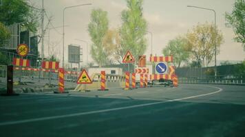 CGI Road construction with warning signs and barriers in an urban setting video