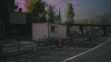 CGI Construction site near road with temporary building at dusk video
