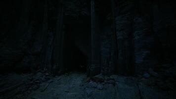 CGI Mysterious entrance to ancient cave in a darkened landscape at night video