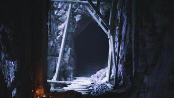 CGI Mysterious mine entrance illuminated by candles in dim light video