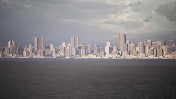 CGI Urban skyline view over calm waters under a cloudy sky at dusk video