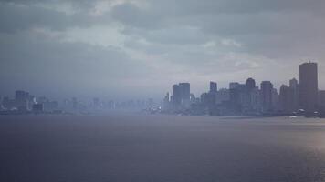 CGI Calm dusk over a city skyline viewed from the waterfront during twilight hours video