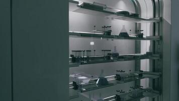 CGI Laboratory shelf filled with glassware and scientific instruments at night video