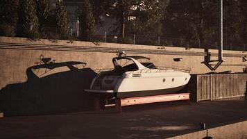 CGI A sleek boat resting quietly at dock during golden hour by the waterfront video
