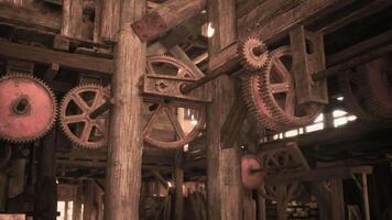 CGI Rustic gears and machinery inside an old wooden workshop in the afternoon video