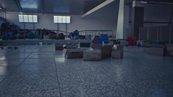 CGI Abandoned airport baggage area with scattered boxes and empty chairs video