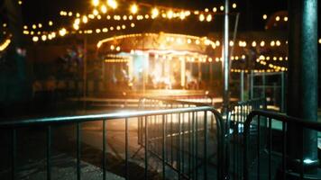 CGI Empty amusement park at night with glowing lights and deserted rides video