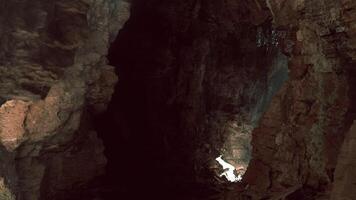 CGI Exploring a mysterious cave illuminated by sunlight in a remote location video