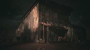CGI Rustic wooden barn illuminated by dramatic lighting at night in rural setting video