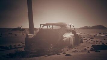 CGI Abandoned vintage car in a desolate desert landscape at sunset video