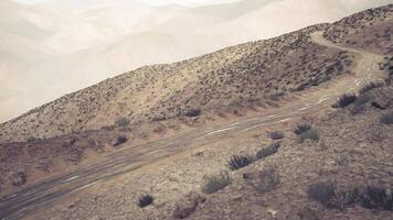 CGI Winding mountain road through the rocky terrain of the Pamir in Tajikistan video