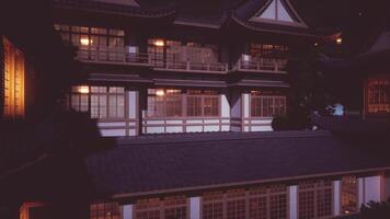 CGI Discover the shoguns grand residence at night with glowing windows video