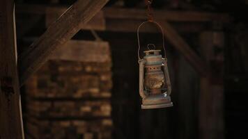 CGI Hanging lantern illuminates a rustic barn interior during twilight hours video