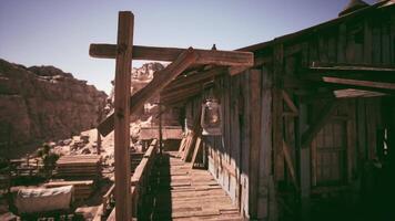 CGI Old wooden building with lantern in a deserted mountain landscape at midday video