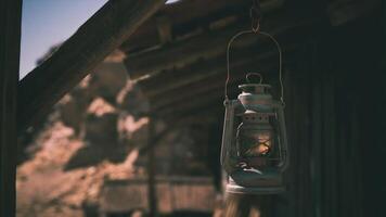 CGI Rustic lantern hanging in an old barn on a sunny afternoon in the countryside video